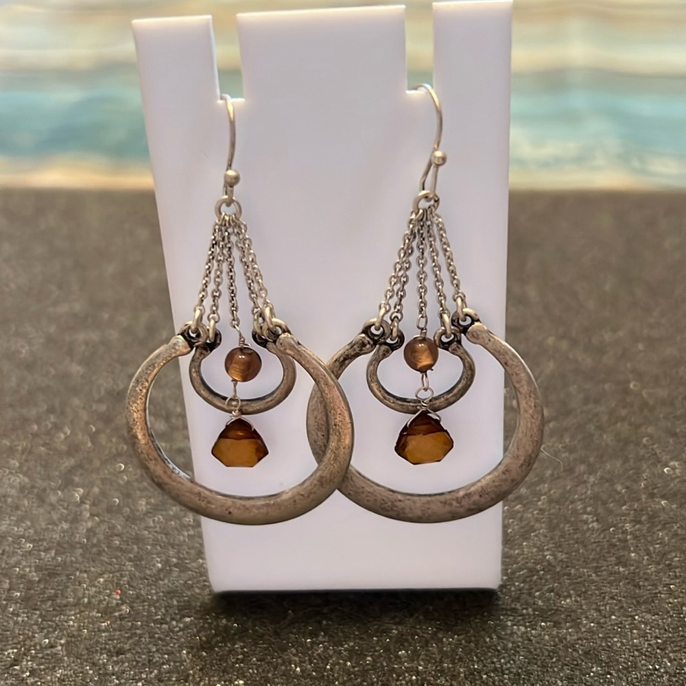 Dangle earrings with a topaz look stone